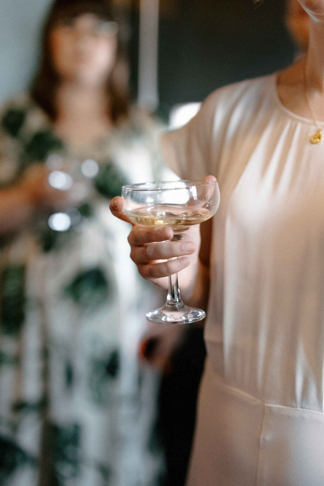 Editorial Photo of bride holding champagne glass at a wedding at Chimney House, Sheffield