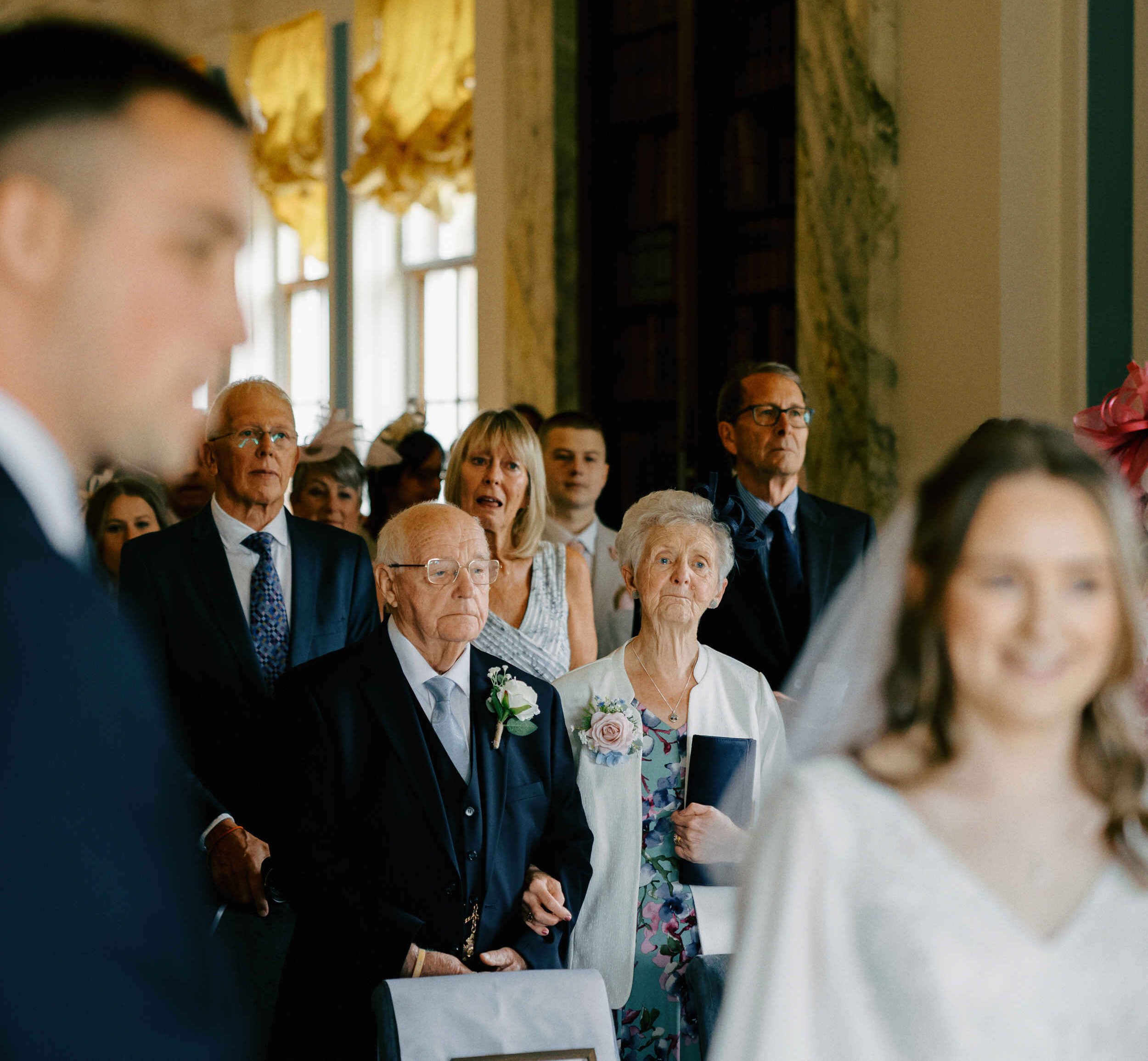 Documentary photograph of the wedding ceremony guests at Sledmere House in Driffield.