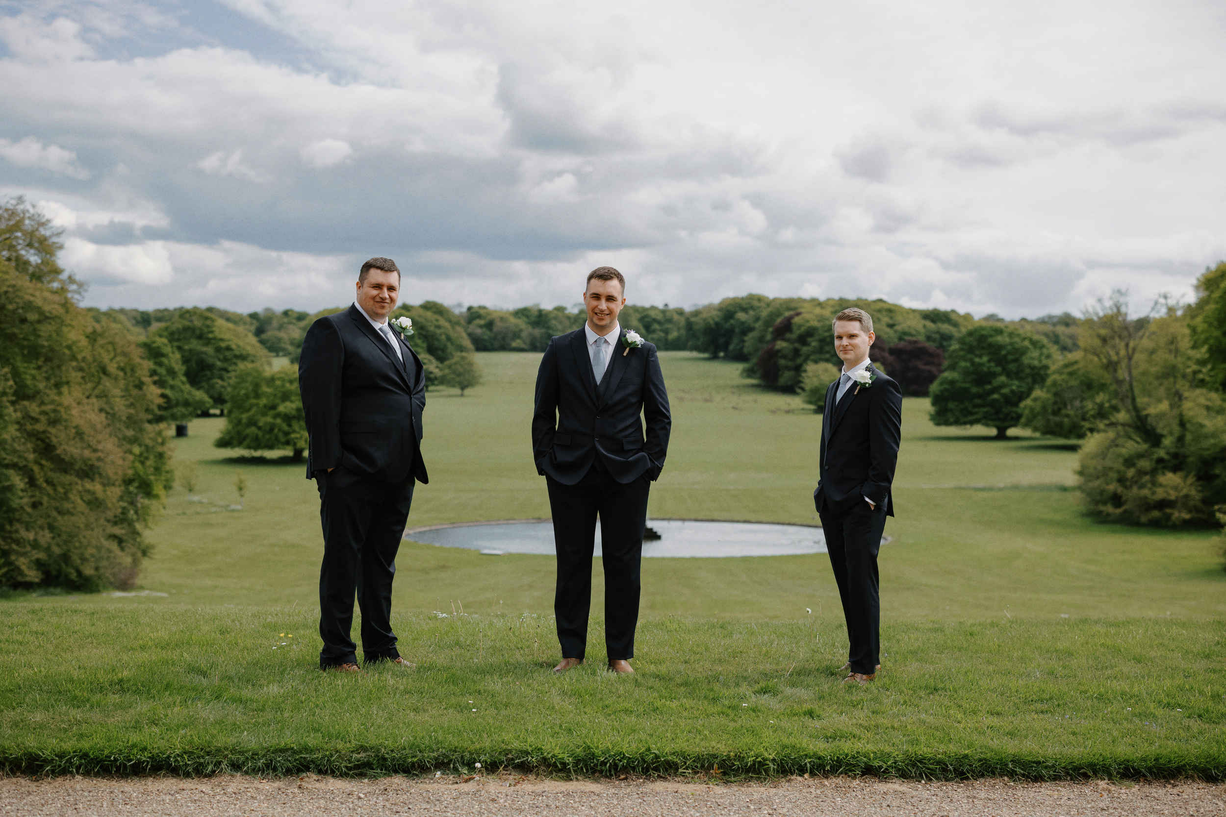 Groomsmen standing in the grounds of Sledmere House in Driffield.